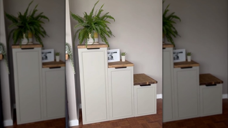 An IKEA TROFAST cabinet modified to have doors and painted beige
