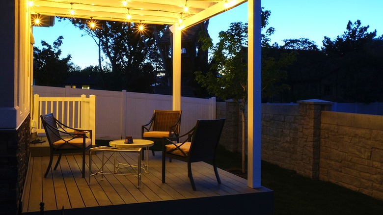 Patio with chairs at night