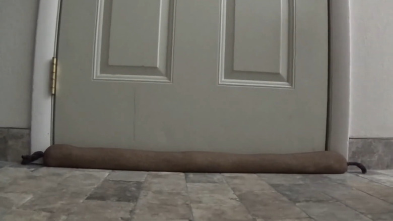 you can use an old sock or hosiery to make a draft excluder