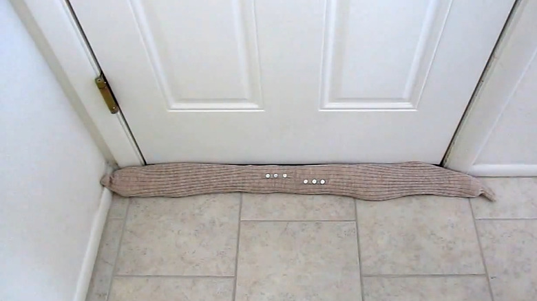 a draft excluder made from a sweater