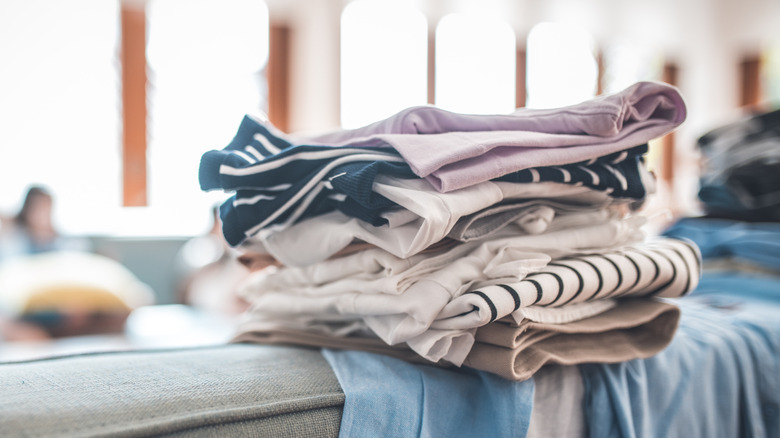 a stack of old tshirts can be used for many things, including door draft stoppers