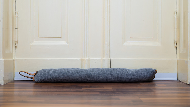 a draft excluder helps keep cold air from coming in under the door