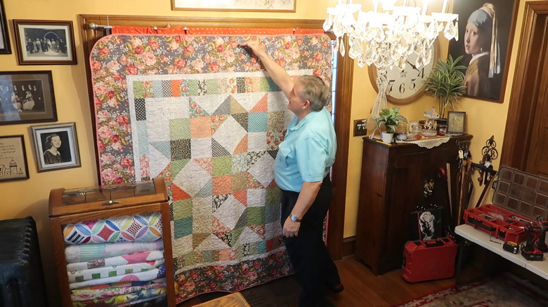 use a quilt to cover an entire door and stop drafts completely