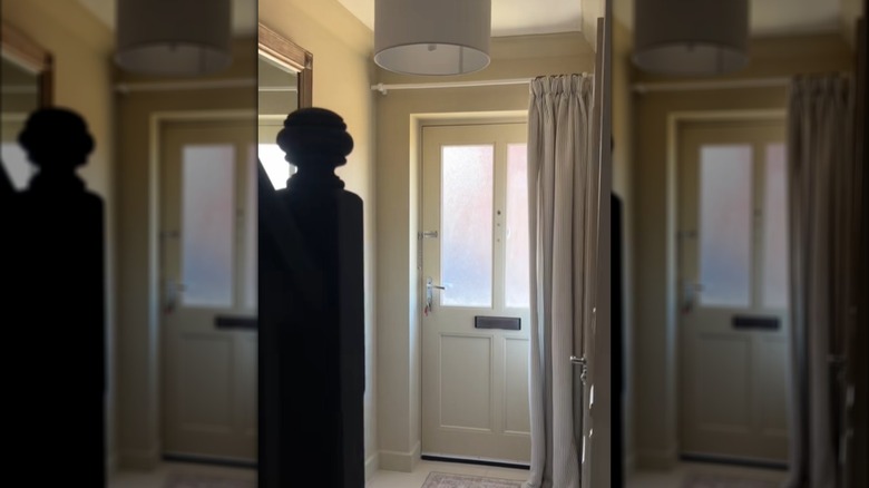 an old curtain can serve as a whole door draft stopper