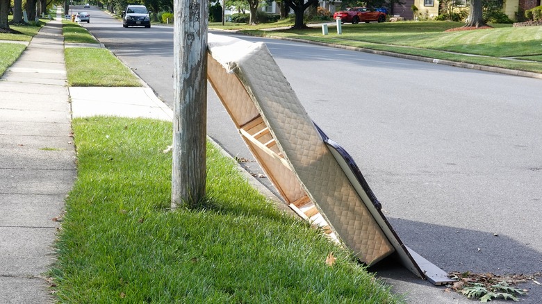 old box spring on curb