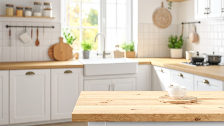 A kitchen counter with an airy kitchen in the background