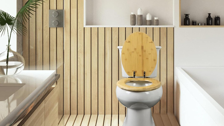 A bamboo toilet cover in a chic bathroom.