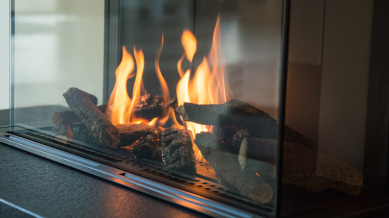 glass fireplace with flames