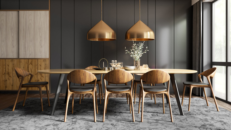 Patterned rug underneath a dining room table and chairs