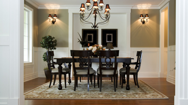 Rug underneath a formal dining room table
