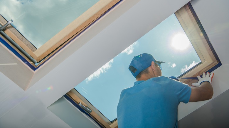 Worker installing skylight