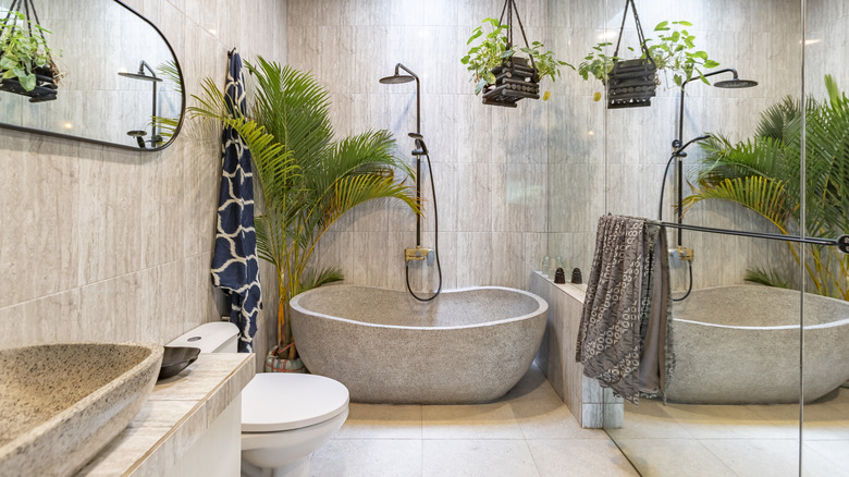 a bathroom with a freestanding stone tub