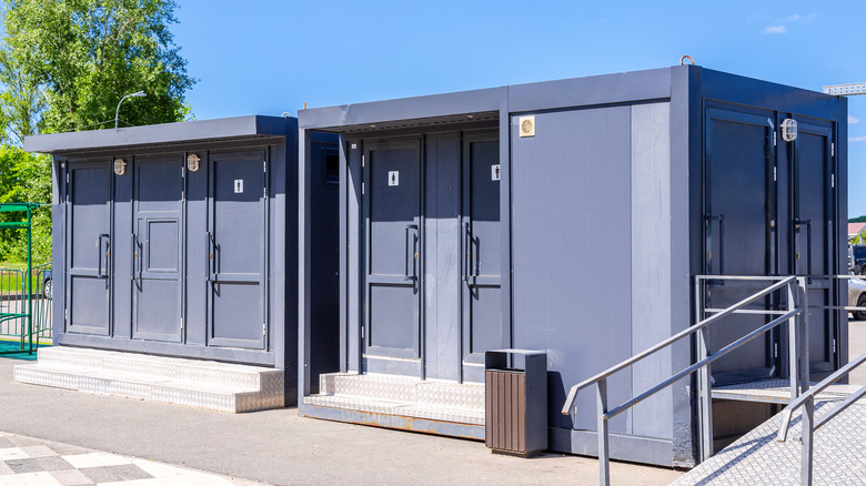 Two outdoor vault toilets 