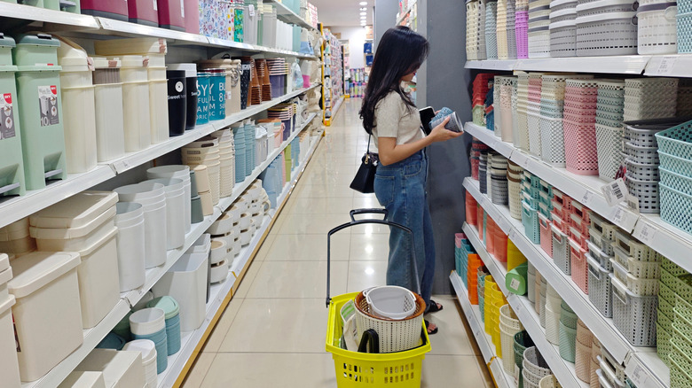 Person shopping for storage containers