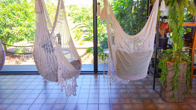 Hanging hammocks with plants