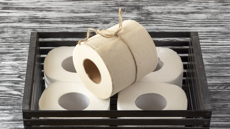 rolls of bamboo toilet paper in crate