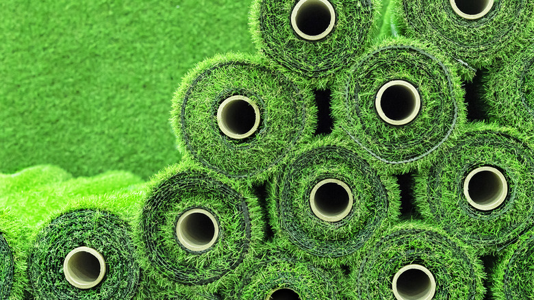 Rolls of artificial turf stacked up before installation