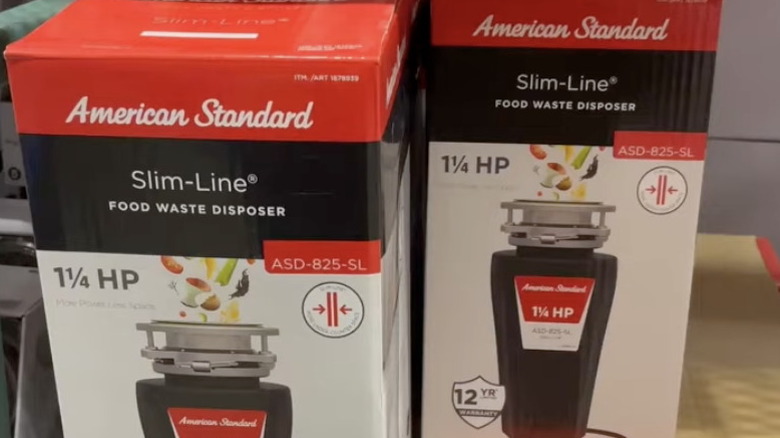 American Standard Slim-Line 1.25HP garbage disposers on a store shelf