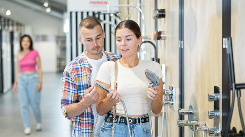Couple shopping for a showerhead