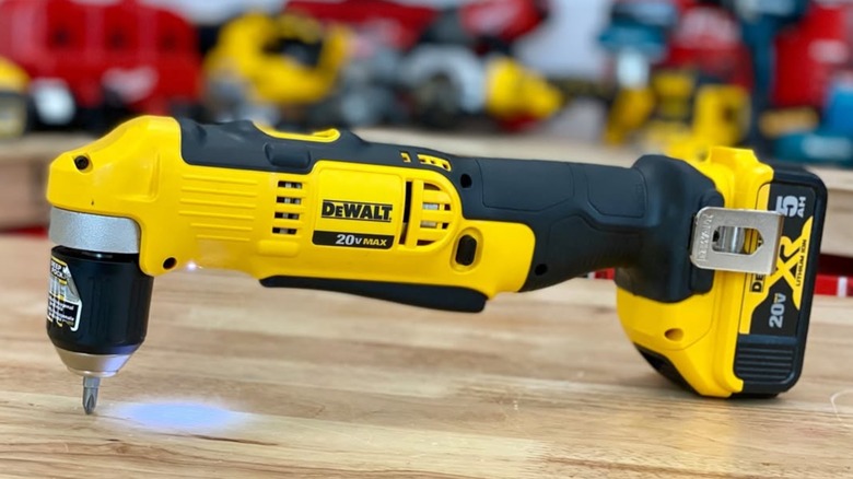 A DeWalt right angle drill displayed on a wood surface