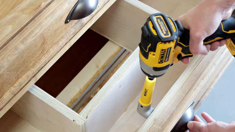 DeWalt DWARA60 right-angle adapter used in a tight space