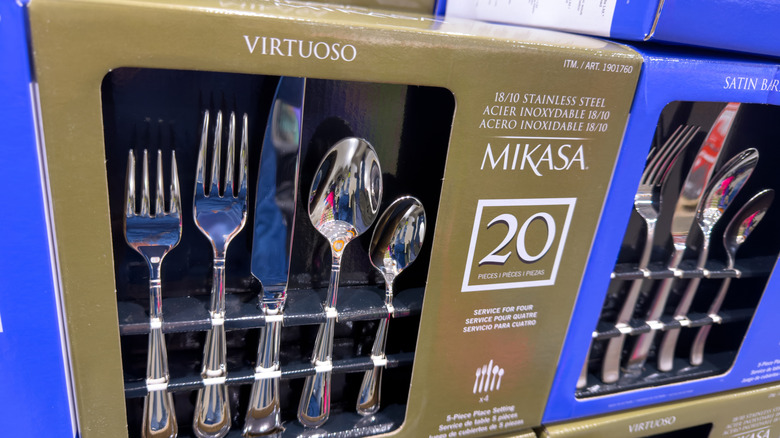 Boxes of premium stainless steel flatware on a shelf