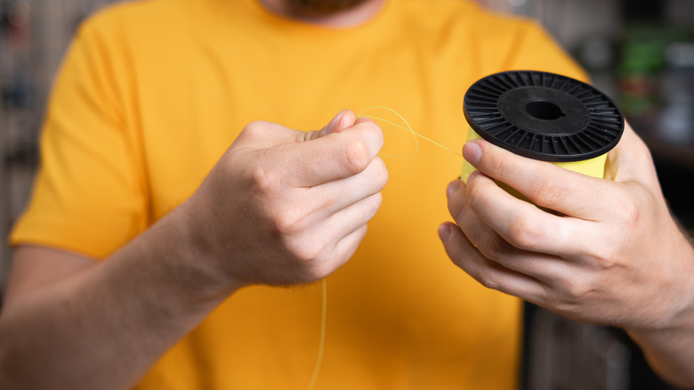 Man holding fishing line