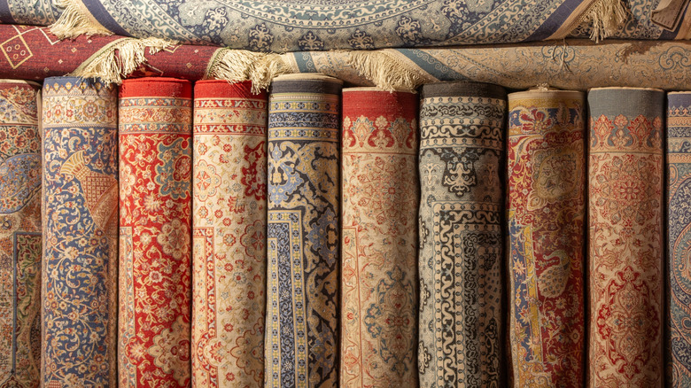 Multiple area rugs on display