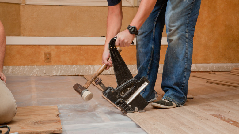 Securing floor with pneumatic nailer