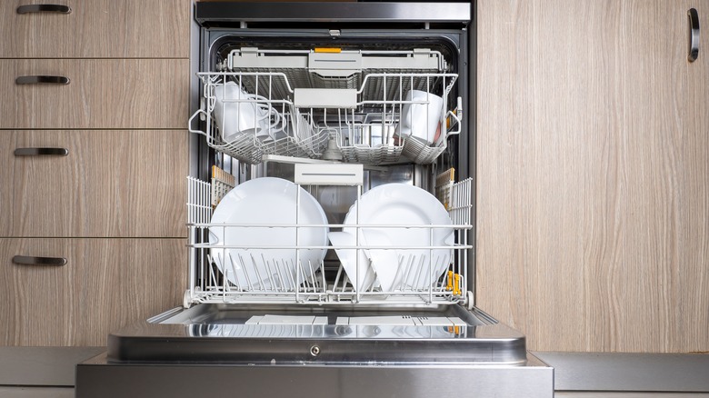 Open dishwasher with clean dishes