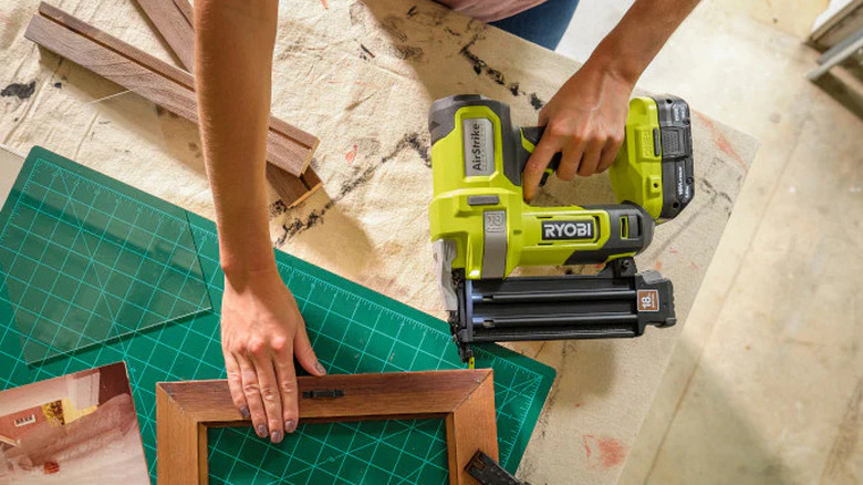 The Ryobi 18V One+ 18GA brad nailer in action