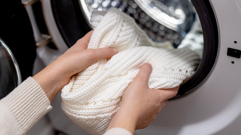 closeup of person doing laundry