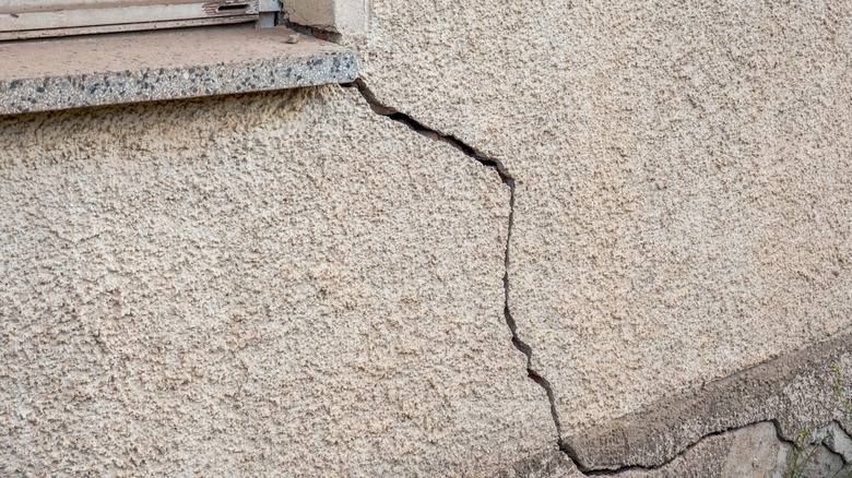 Close-up of a large crack in house exterior