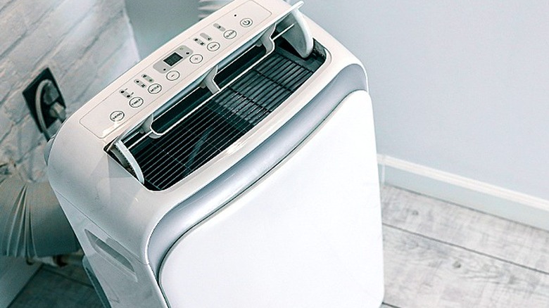 Top view of a portable AC unit in the process of cooling a room