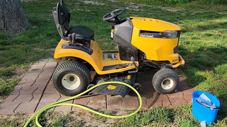 Preparing to wash a riding mower