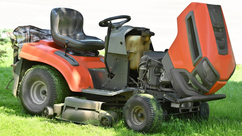 Riding mower after mowing the grass