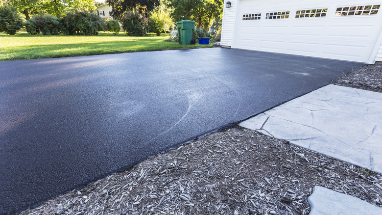 A fresh blacktop on an asphalt driveway.