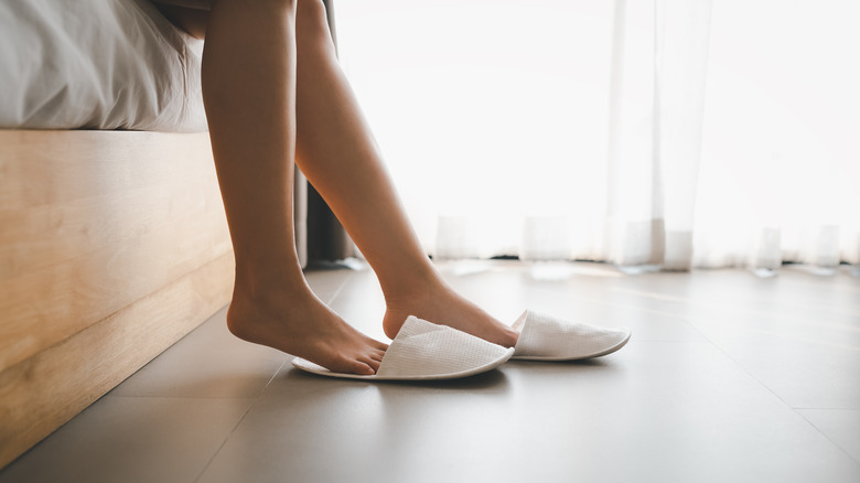 woman with slippers on floor