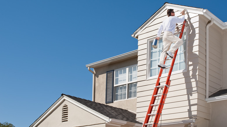 man painting exterior