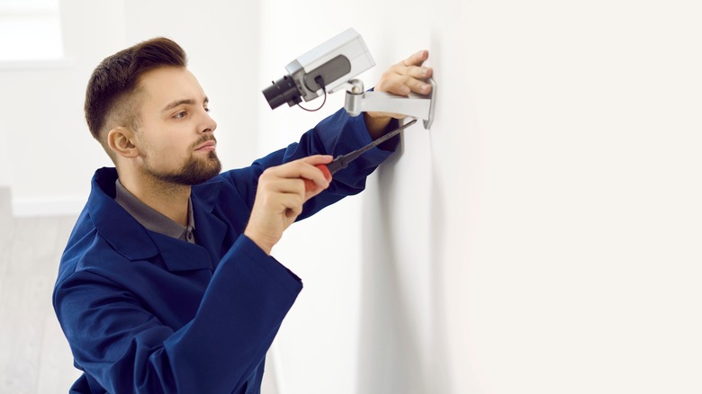 professional installing home security system