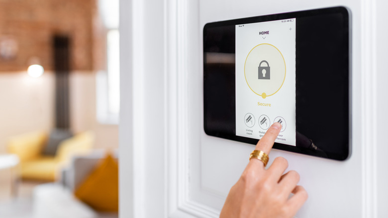 person controlling home security system