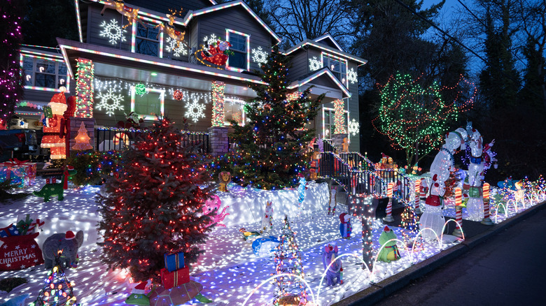A home with colorful Christmas lights lit up at night.