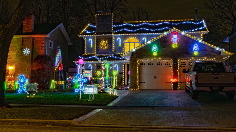 A house with Christmas lights lit up at night.
