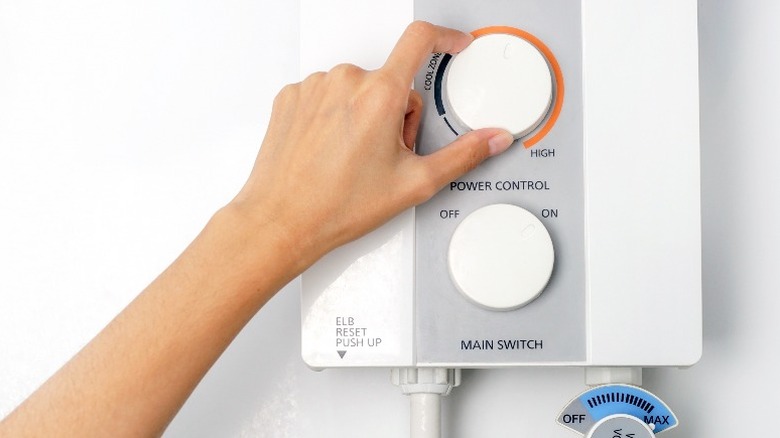 Hand adjusting tankless heater dial