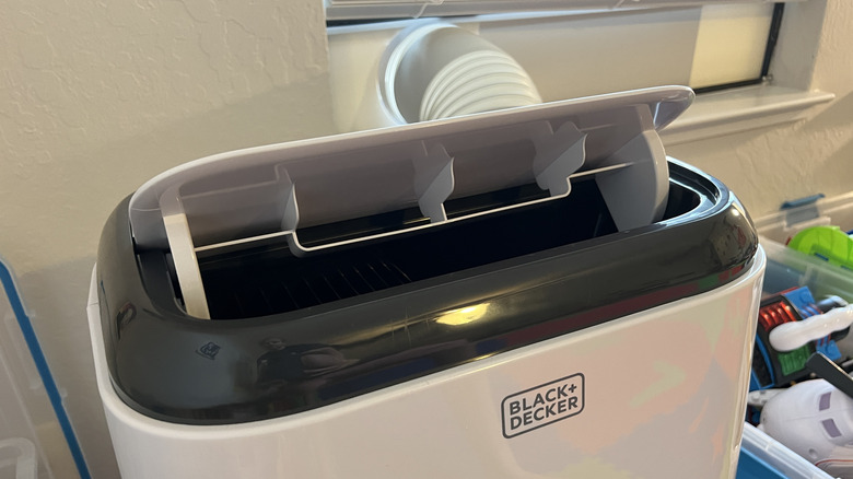 A children's playroom with a portable air conditioner
