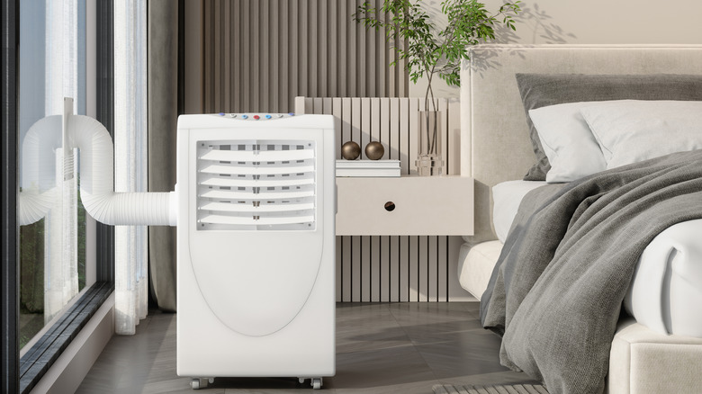 A portable air conditioner installed in a bedroom
