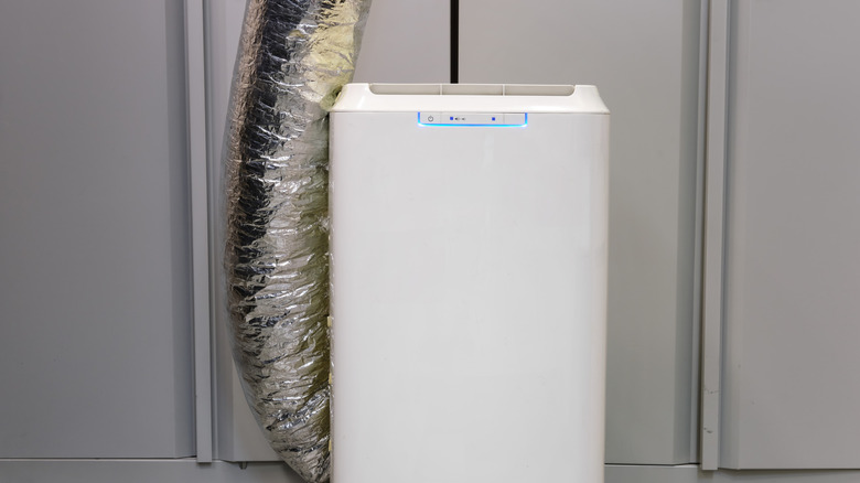 A portable air conditioner with an awkwardly insulated exhaust pipe