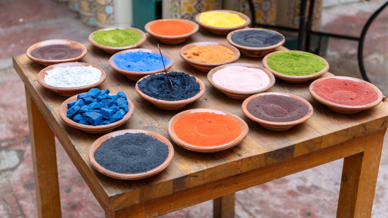 A table of natural pigments in bowls