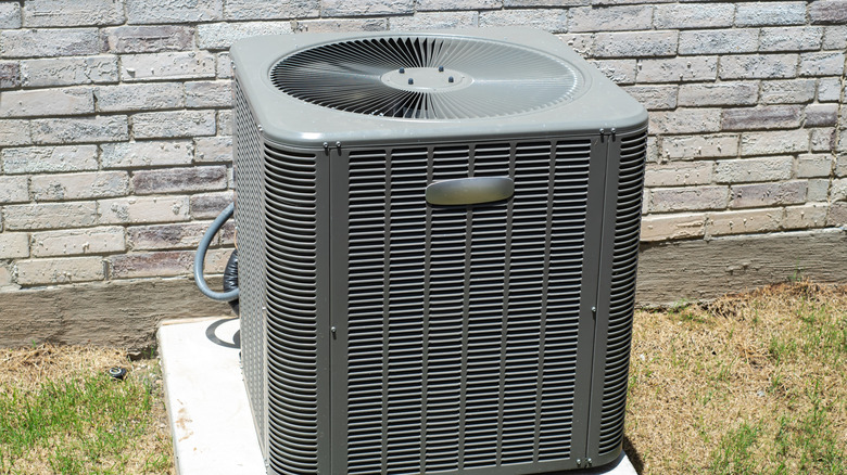 An AC condenser unit in full sun