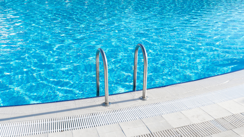 Swimming pool with stair and water.